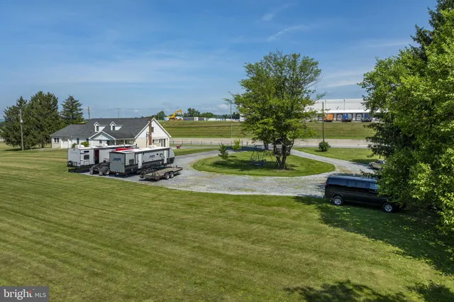 a view of a swimming pool with an outdoor space and seating area