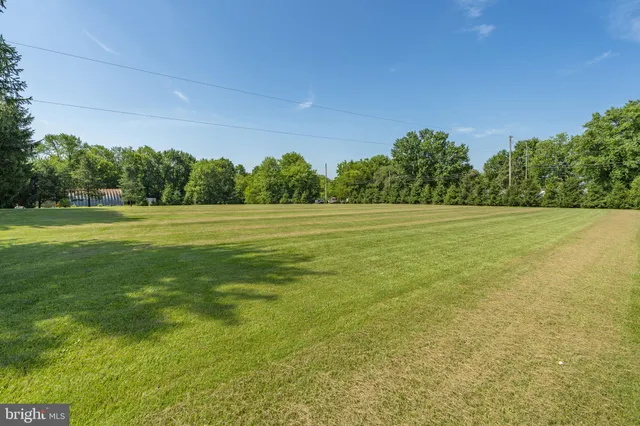 a view of a city from a balcony with seating area
