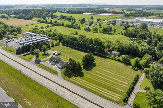 a dining room with furniture and a kitchen view