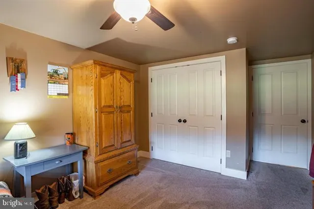 a kitchen with refrigerator and cabinets