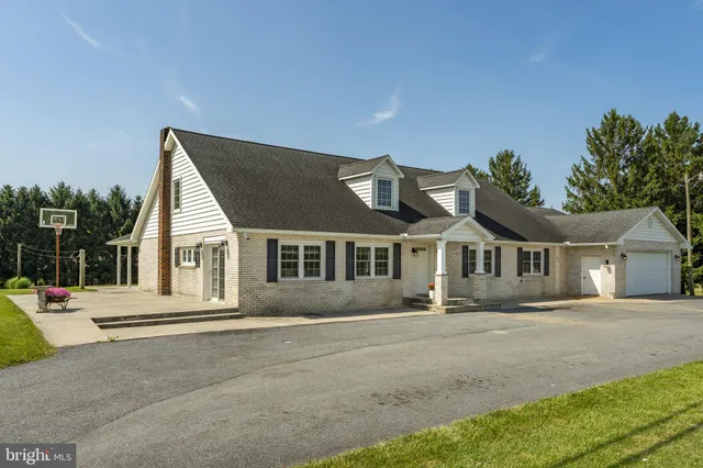 a view of a backyard with sitting area