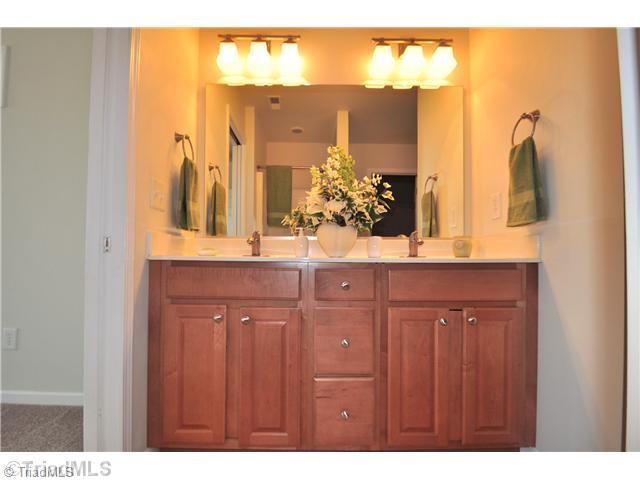 2561 Peppertree Ridge Road Randleman, NC 27317 - Photo 11 of 16 Master Bath/Spa. Spacious Master Suite offers his and her dual sink vanities and a large walk-in closet.
