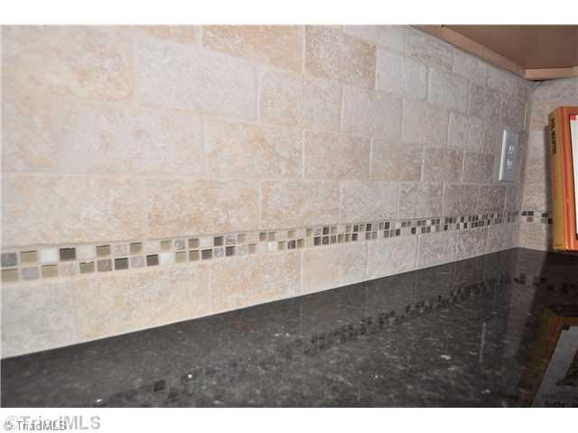 2561 Peppertree Ridge Road Randleman, NC 27317 - Photo 6 of 16 Kitchen. Beautiful Tuscan style tile backsplash accents the kitchen beautifully.