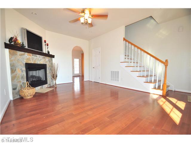 2561 Peppertree Ridge Road Randleman, NC 27317 - Photo 7 of 16 Living Room. Spacious Living Room is highlighted by the stone, gas log fireplace.