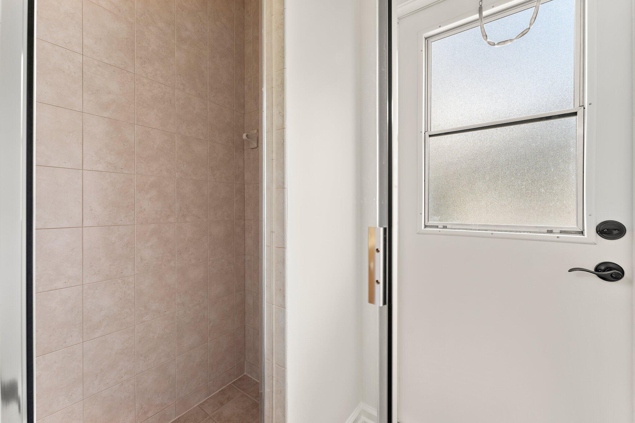 15784 Alexander Run Jupiter, FL 33478 - Photo 30 of 44 Shower w/cabana door