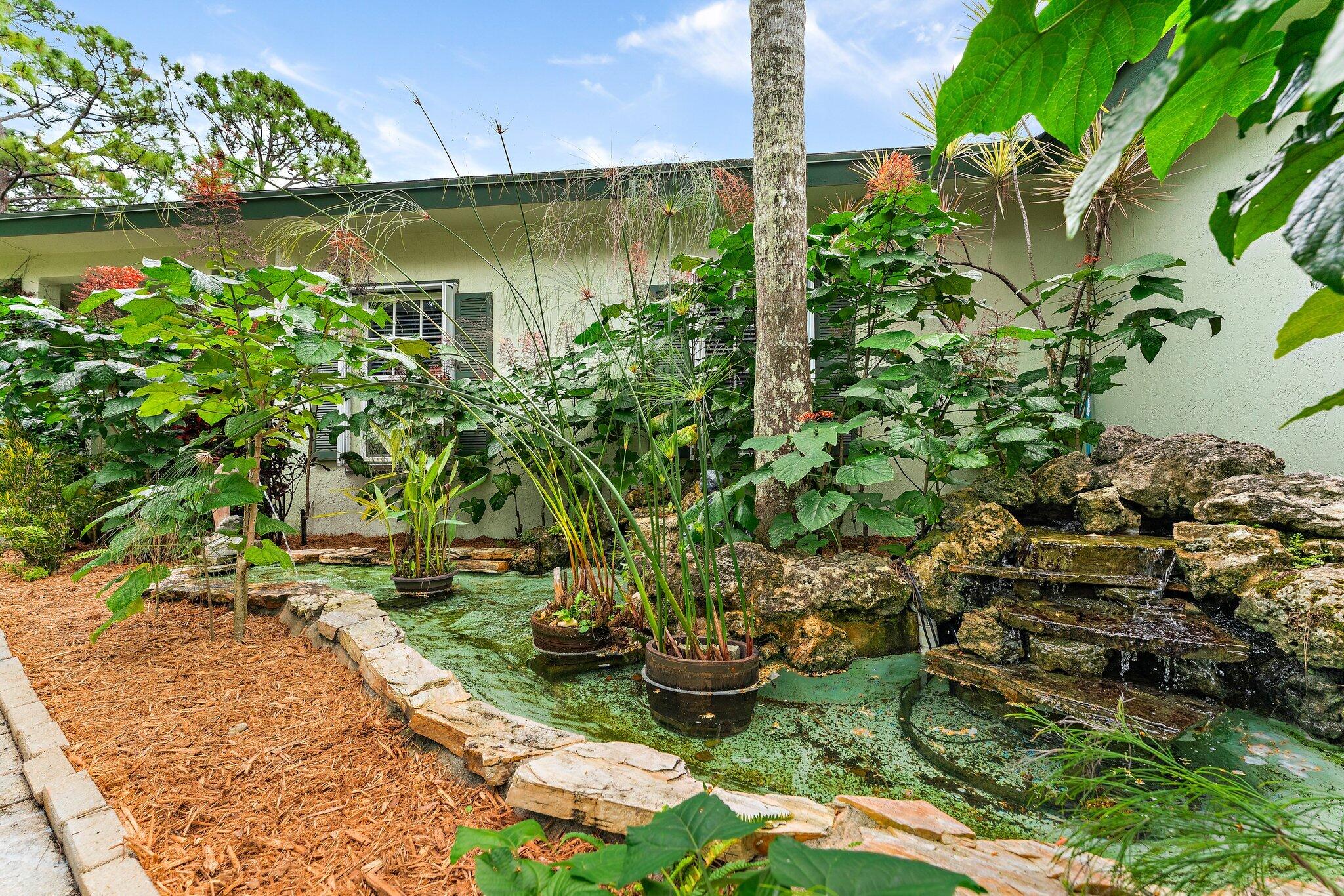 15784 Alexander Run Jupiter, FL 33478 - Photo 35 of 44 Garden at entry