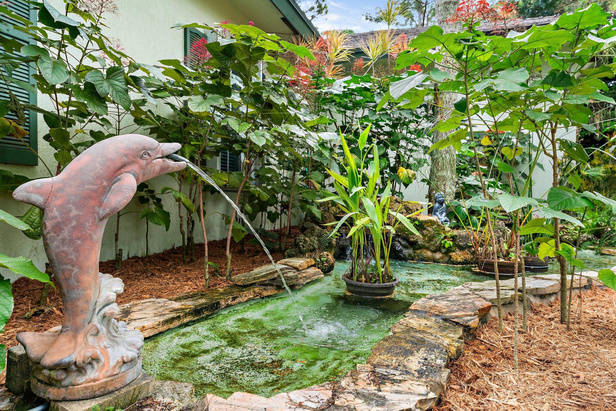 15784 Alexander Run Jupiter, FL 33478 - Photo 36 of 44 Sweet fountain & koi pond at entry