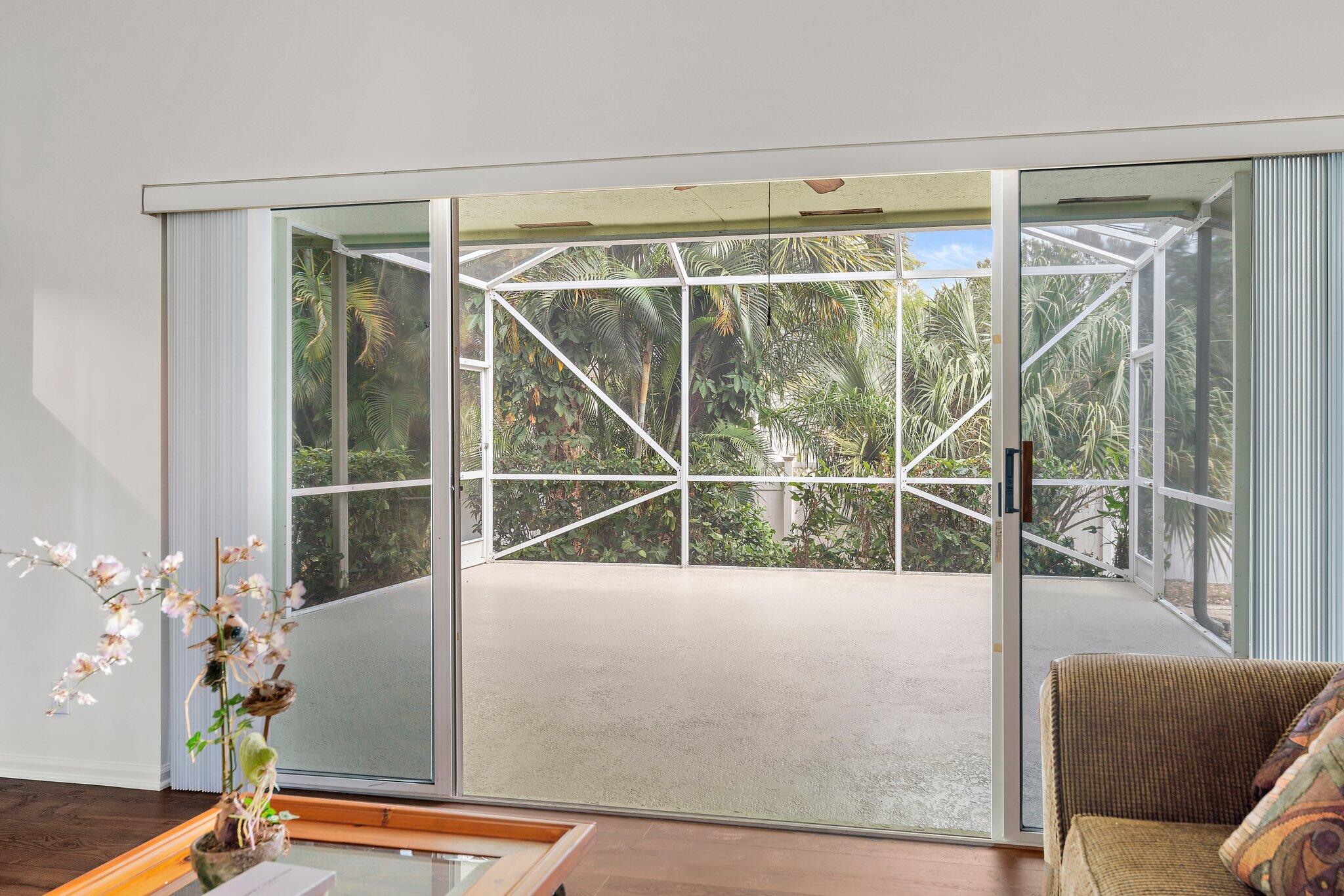 15784 Alexander Run Jupiter, FL 33478 - Photo 8 of 44 Sliding glass doors lead spacious lanai