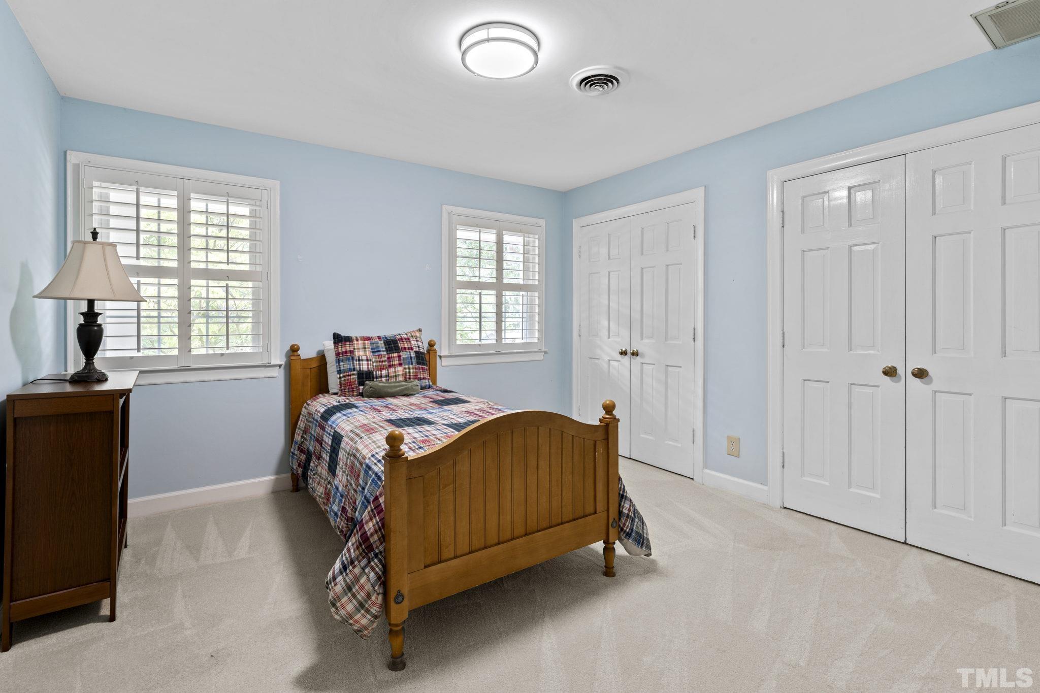 3412 Wembley Court Raleigh, NC 27607 - Photo 29 of 46 a bedroom with a bed and a window