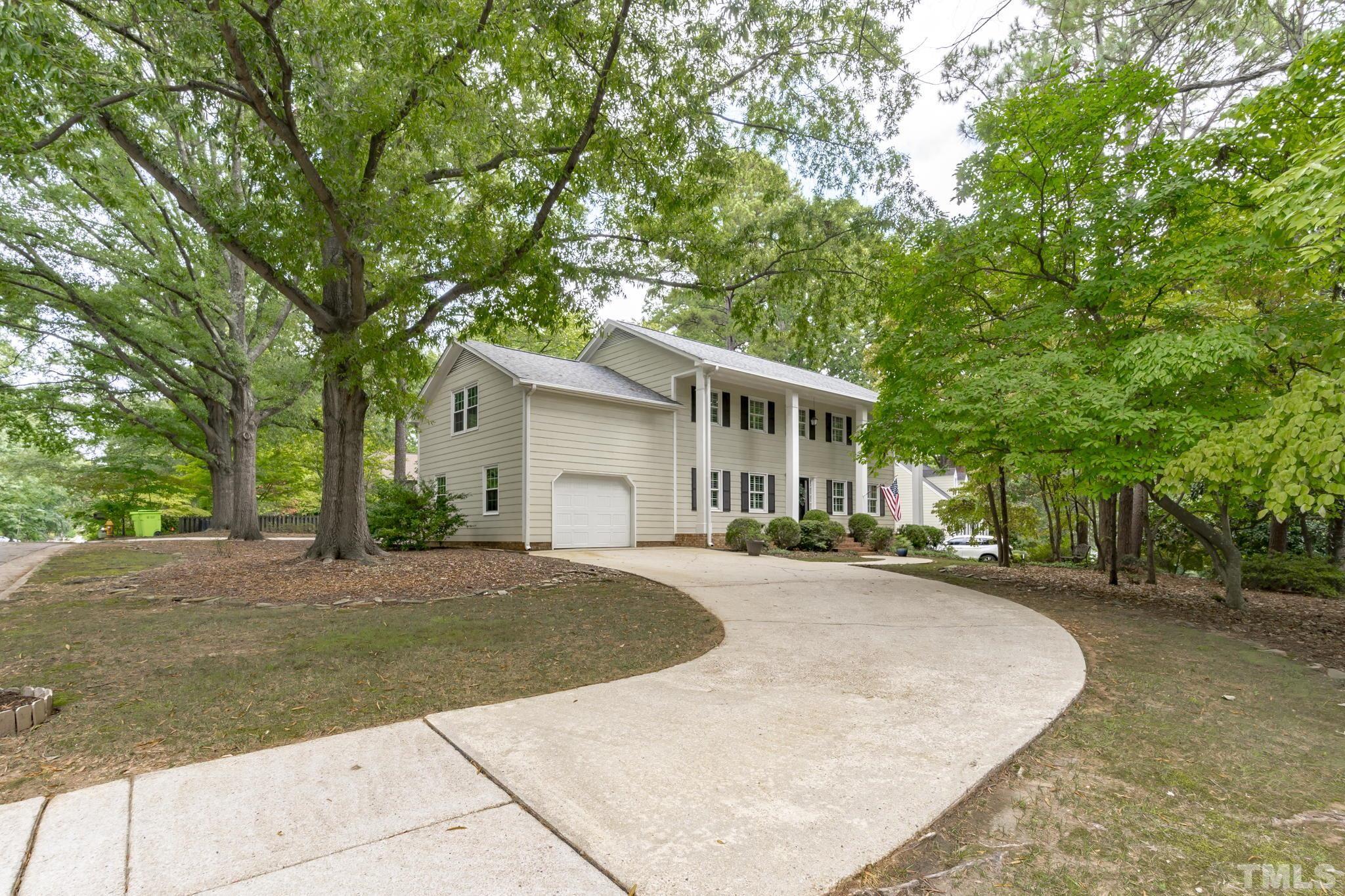3412 Wembley Court Raleigh, NC 27607 - Photo 3 of 46 a view of a house with a yard and large tree