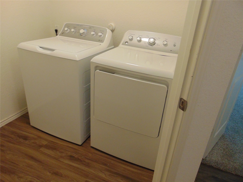 181 Crystal River Road Kyle, TX 78640 - Photo 4 of 12 a utility room with dryer and washer