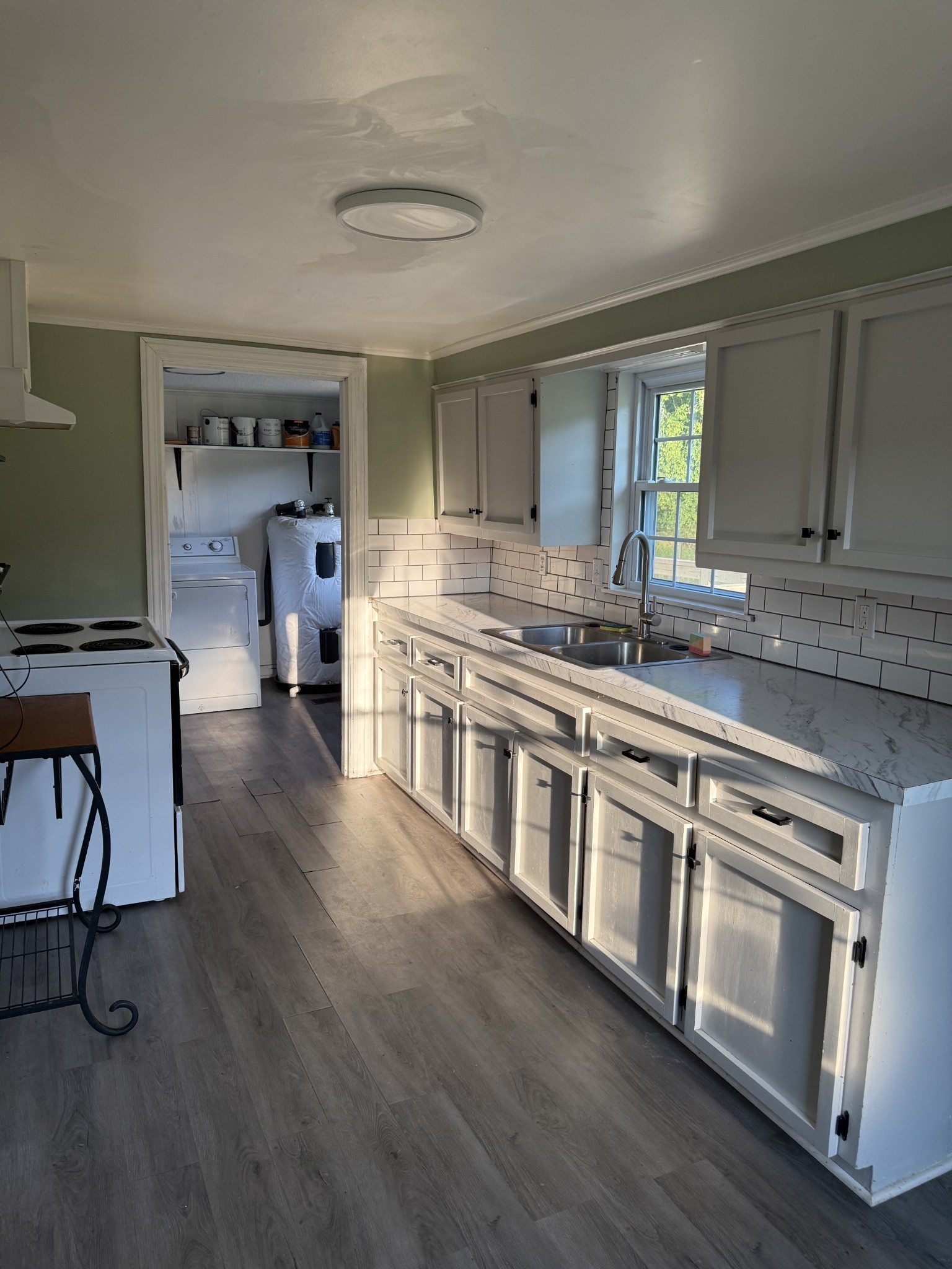 520 Pumpkin Branch Road Dixon Springs, TN 37057 - Photo 13 of 36 a kitchen with stainless steel appliances granite countertop a stove and cabinets