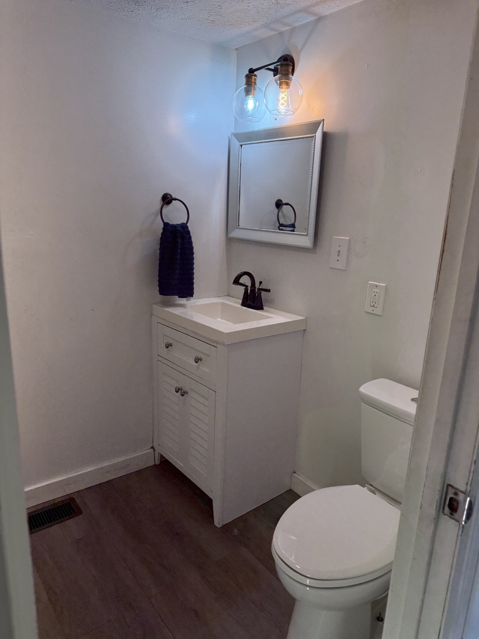 520 Pumpkin Branch Road Dixon Springs, TN 37057 - Photo 14 of 36 a bathroom with a toilet a sink and mirror