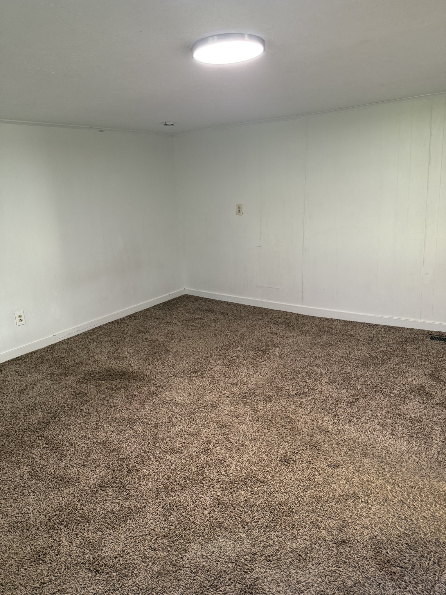 520 Pumpkin Branch Road Dixon Springs, TN 37057 - Photo 17 of 36 an empty room with a natural light