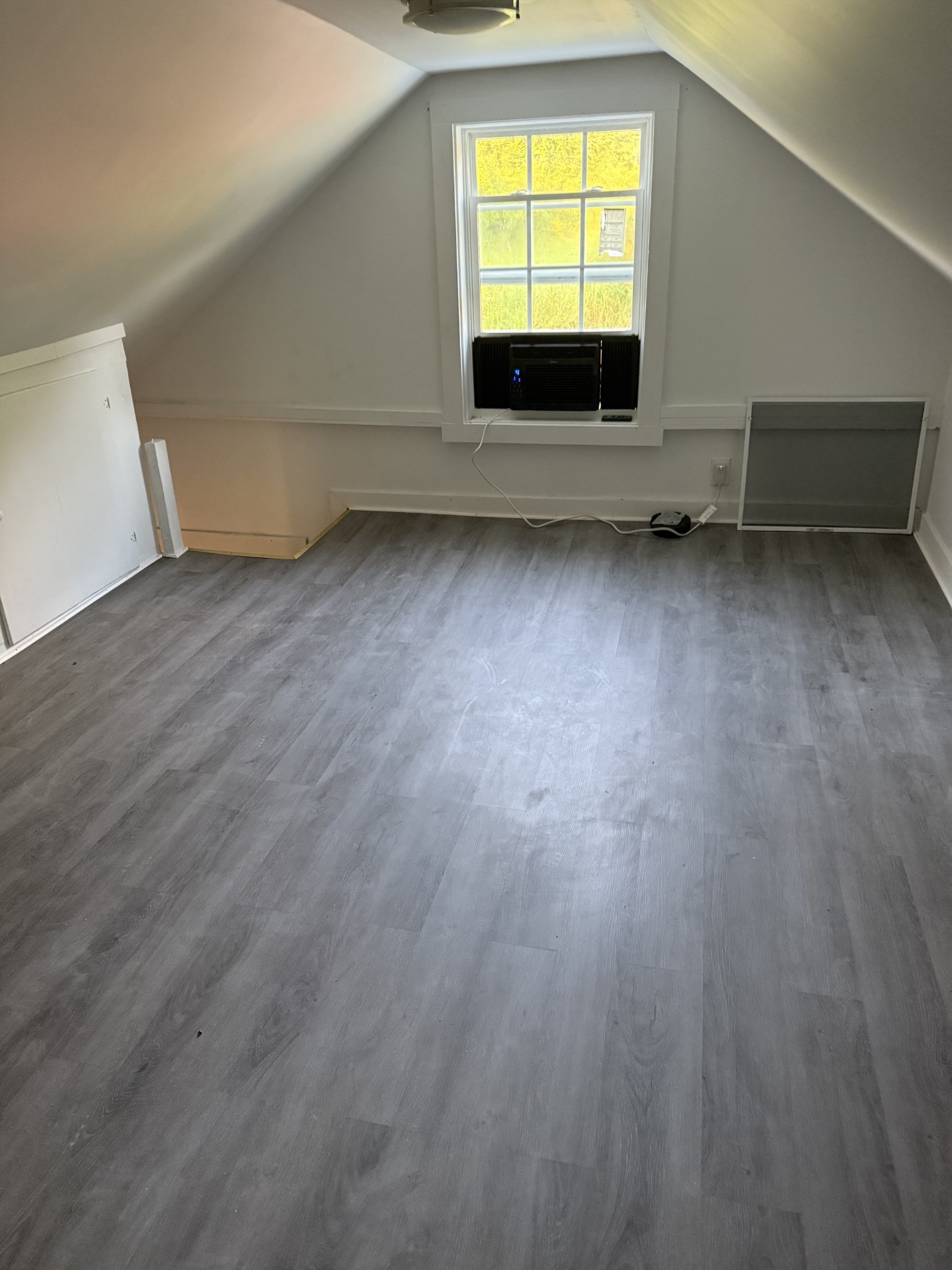 520 Pumpkin Branch Road Dixon Springs, TN 37057 - Photo 20 of 36 a view of a room with wooden floor and a window