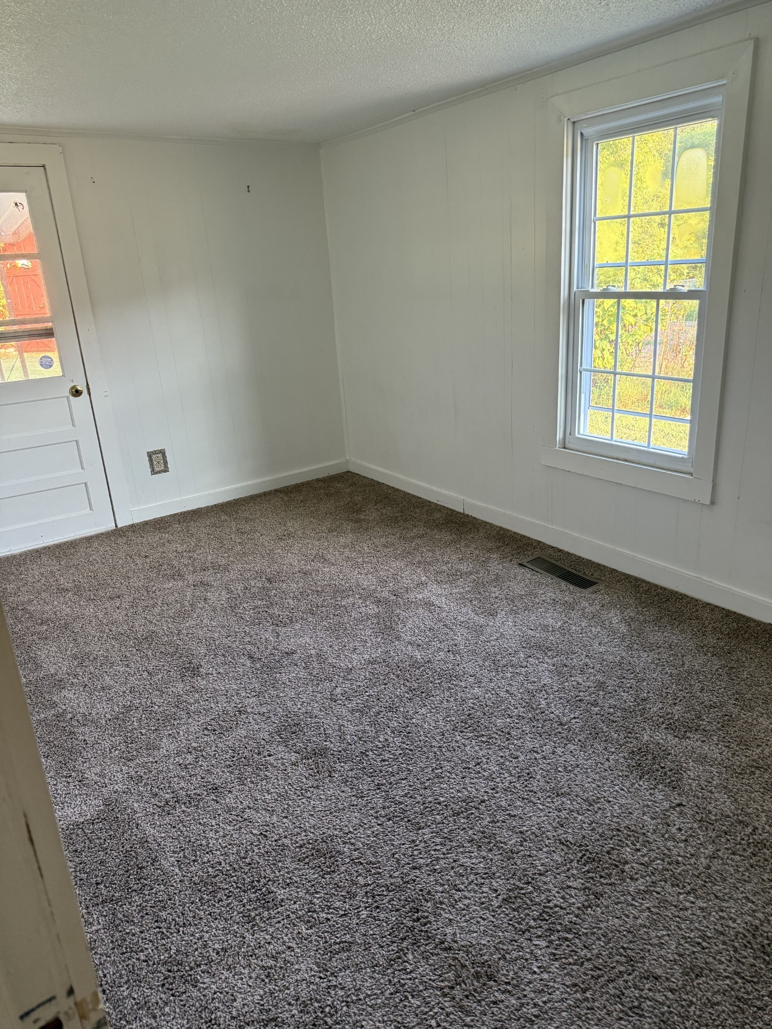 520 Pumpkin Branch Road Dixon Springs, TN 37057 - Photo 24 of 36 an empty room with windows