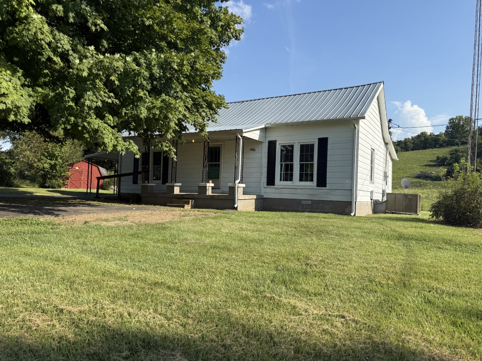 520 Pumpkin Branch Road Dixon Springs, TN 37057 - Photo 35 of 36 a view of a house with a backyard