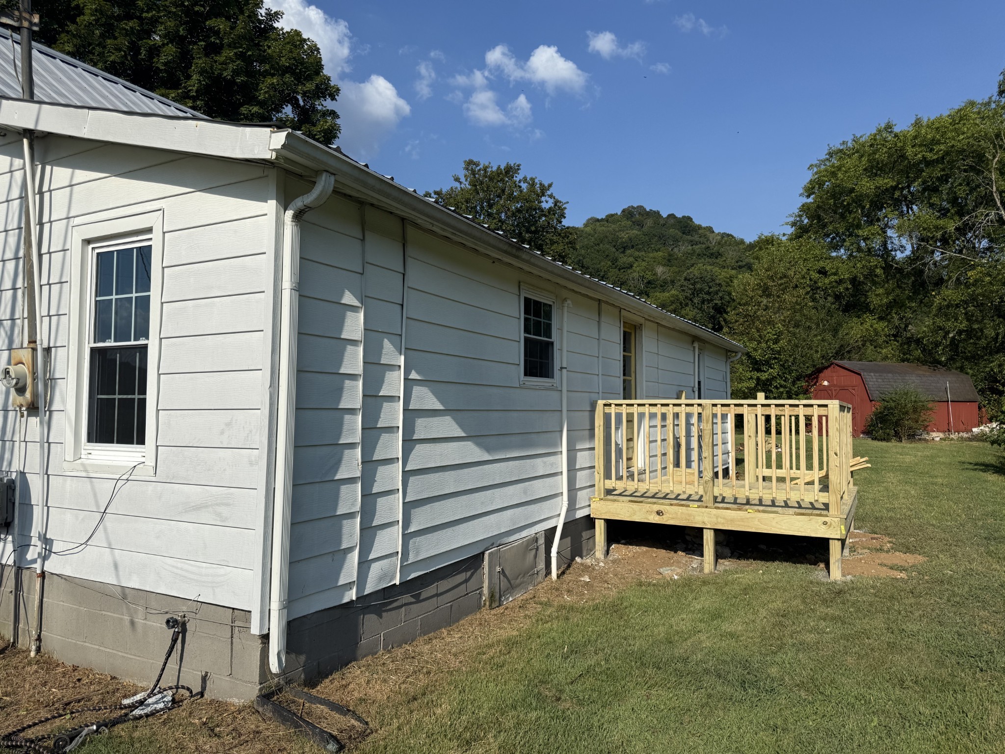 520 Pumpkin Branch Road Dixon Springs, TN 37057 - Photo 6 of 36 a view of a deck with a chair