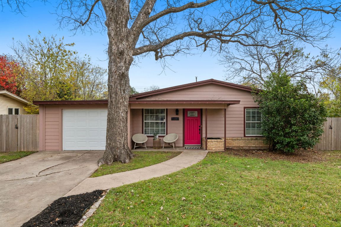 7517 Delafield Lane Austin, TX 78752 - Photo 2 of 39 View of front yard, driveway and garage.