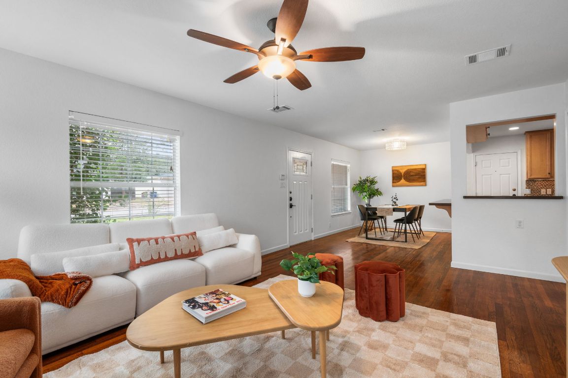 7517 Delafield Lane Austin, TX 78752 - Photo 8 of 39 View of living room into dining room and kitchen.