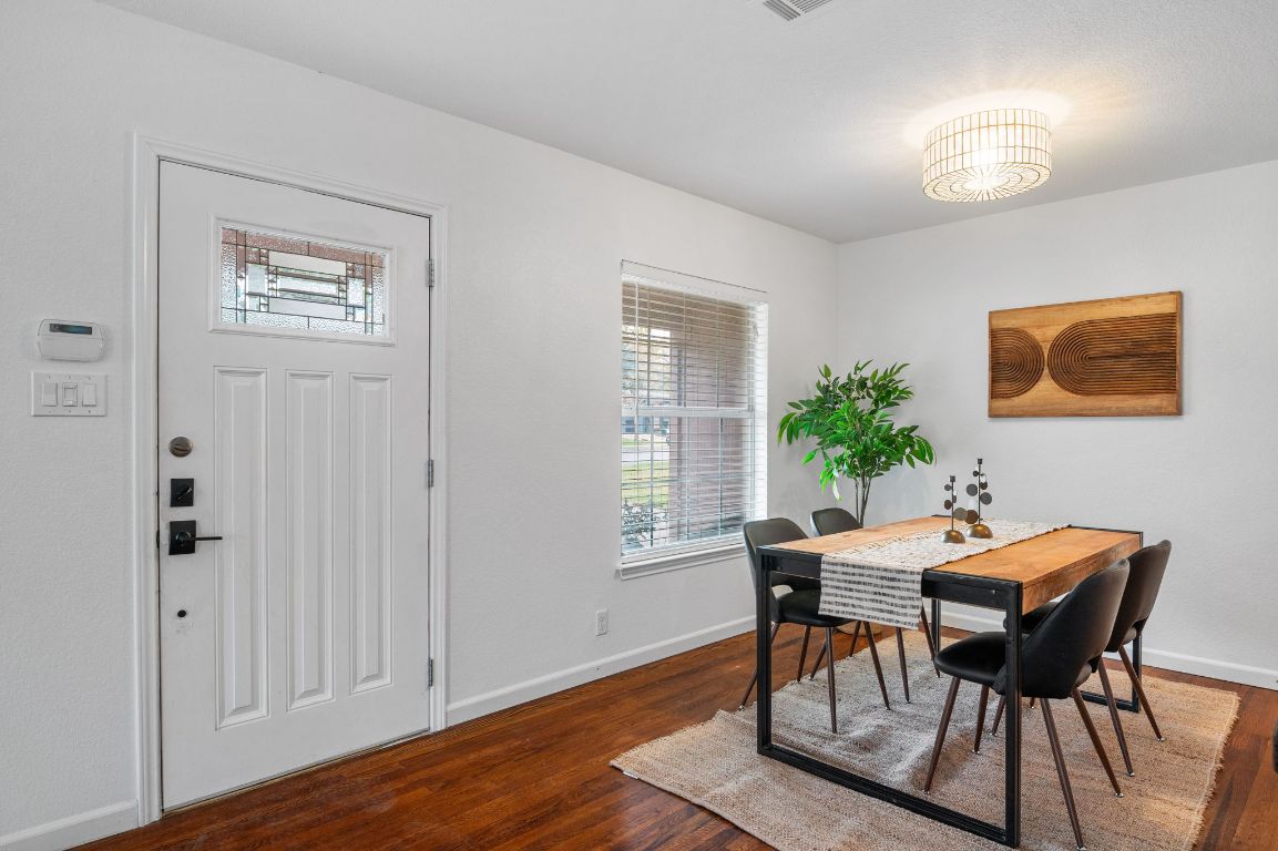 7517 Delafield Lane Austin, TX 78752 - Photo 9 of 39 Dining room and front door.