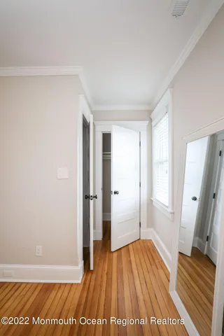 a view of entryway with rack on the wall