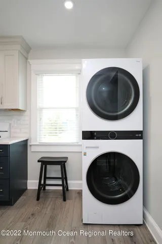 a living room with a washer and dryer