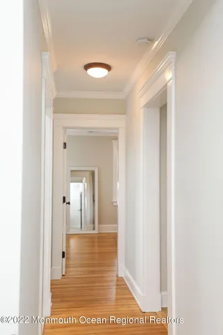 a view of a bathroom from a hallway