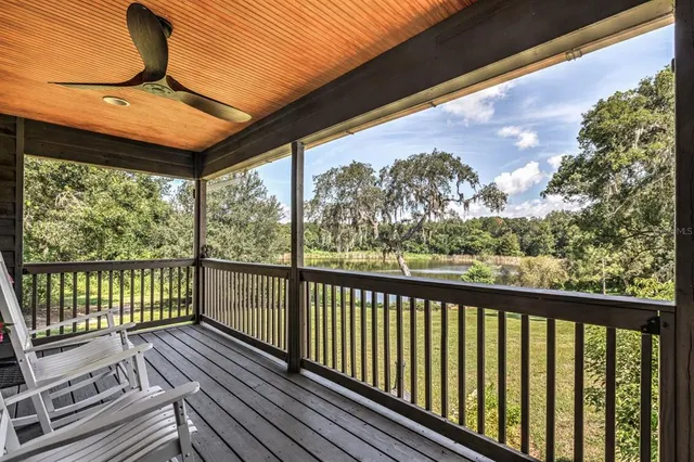 a view of a balcony with wooden floor