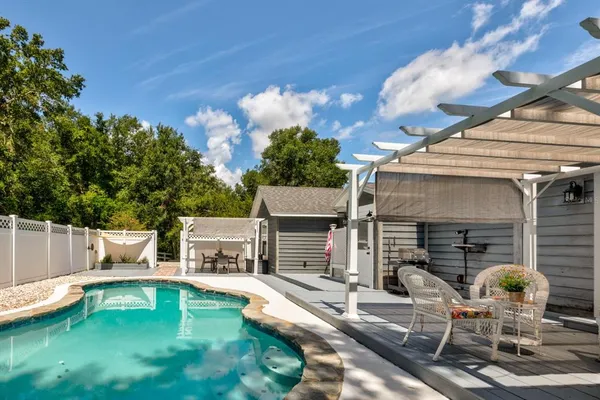 a view of a house with swimming pool