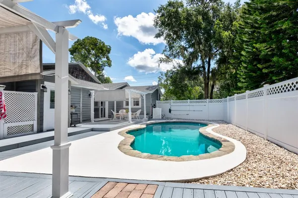 a front view of a building with outdoor seating