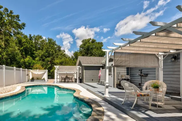 a view of a house with swimming pool