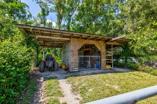 a view of a house with a yard and plants
