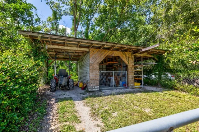 a view of a house with a yard and plants