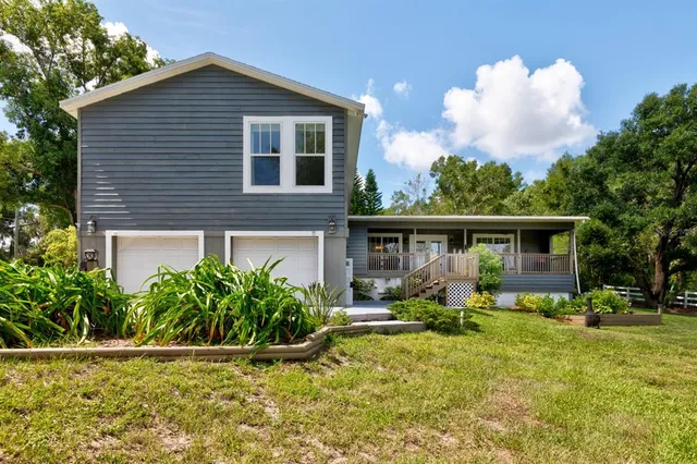 a view of a house with a big yard