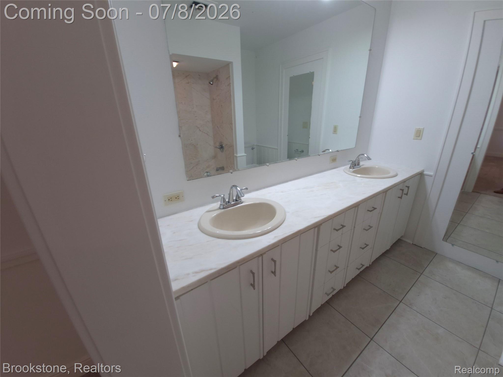 4140 South Henderson Road Davison, MI 48423 - Photo 68 of 98 Dual vanity with integrated sinks and a light-toned countertop