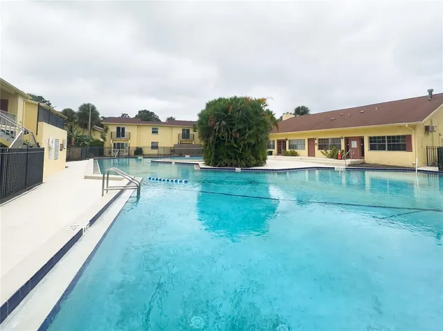 a view of swimming pool with a yard