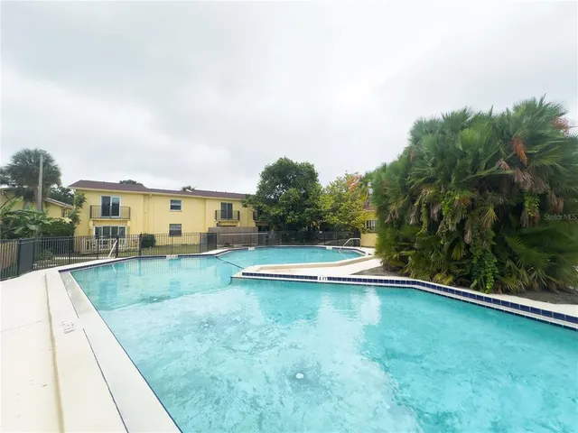 a front view of a house with a big yard
