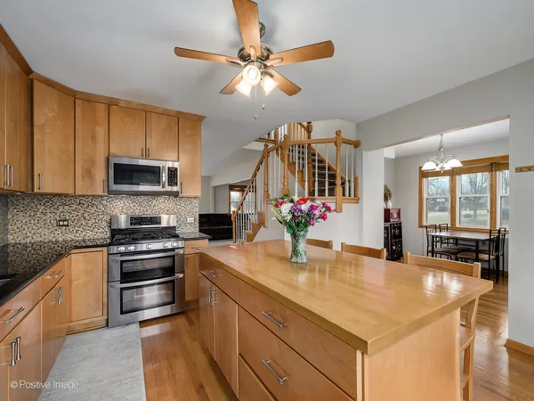 a kitchen with sink cabinets and stainless steel appliances