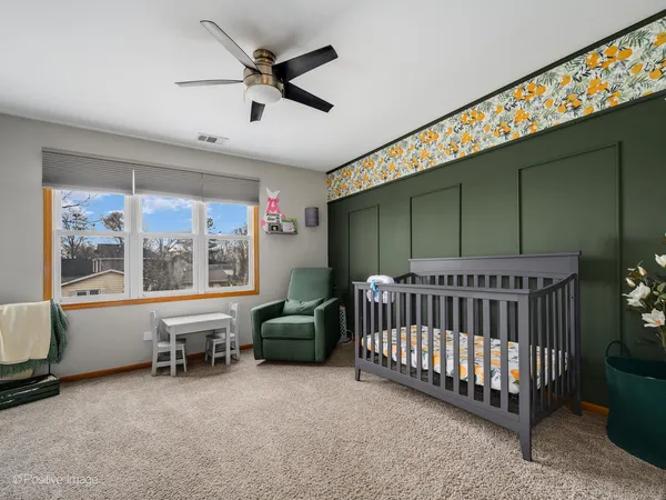 a bed room with furniture and a window