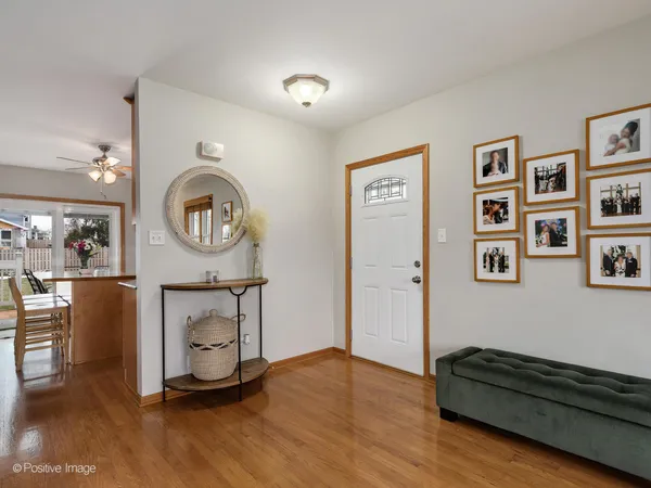 a living room with furniture and a mirror