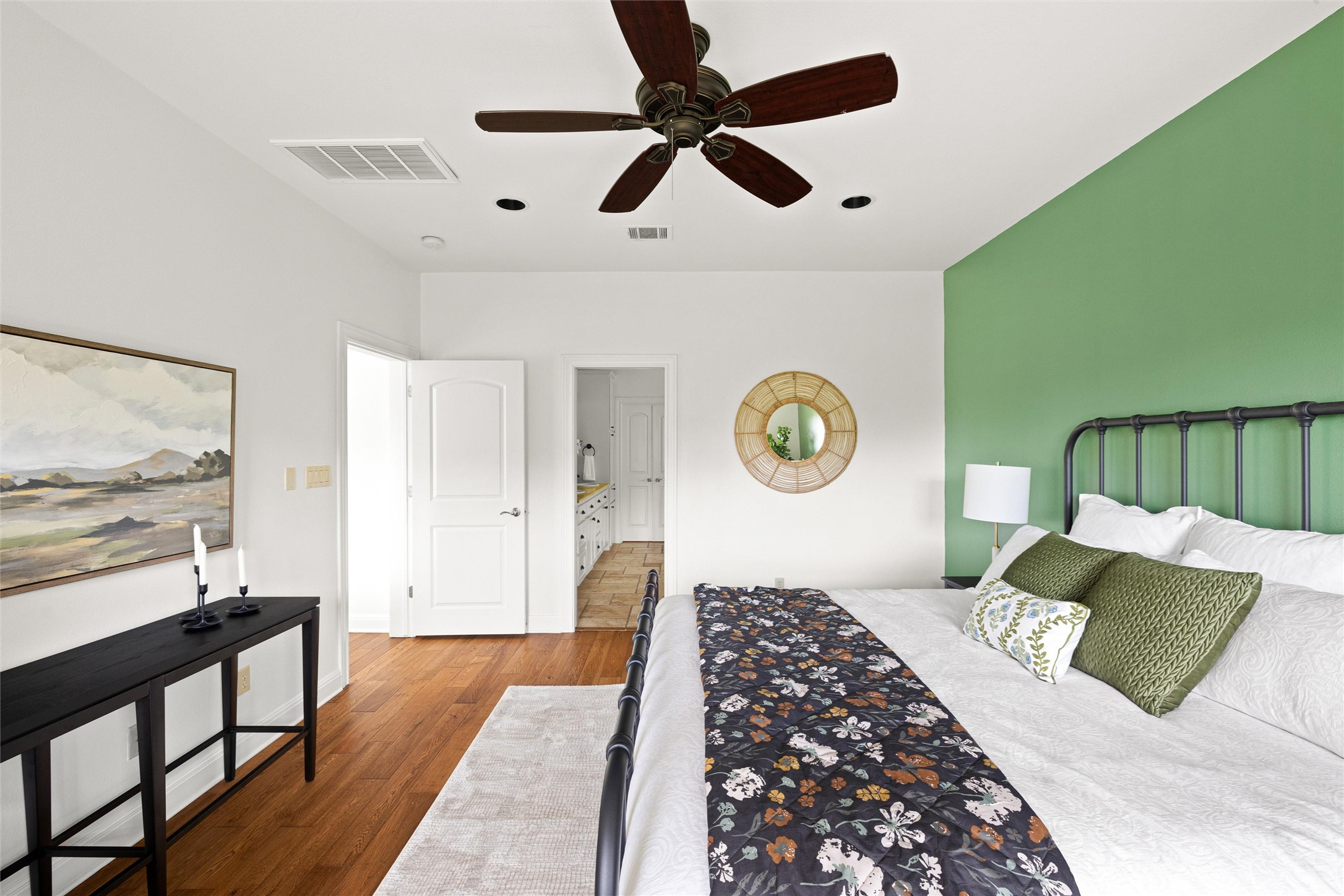 8540 Adirondack Trail, Unit 21 Austin, TX 78759 - Photo 18 of 40 a bedroom with a bed and a lamp on a table