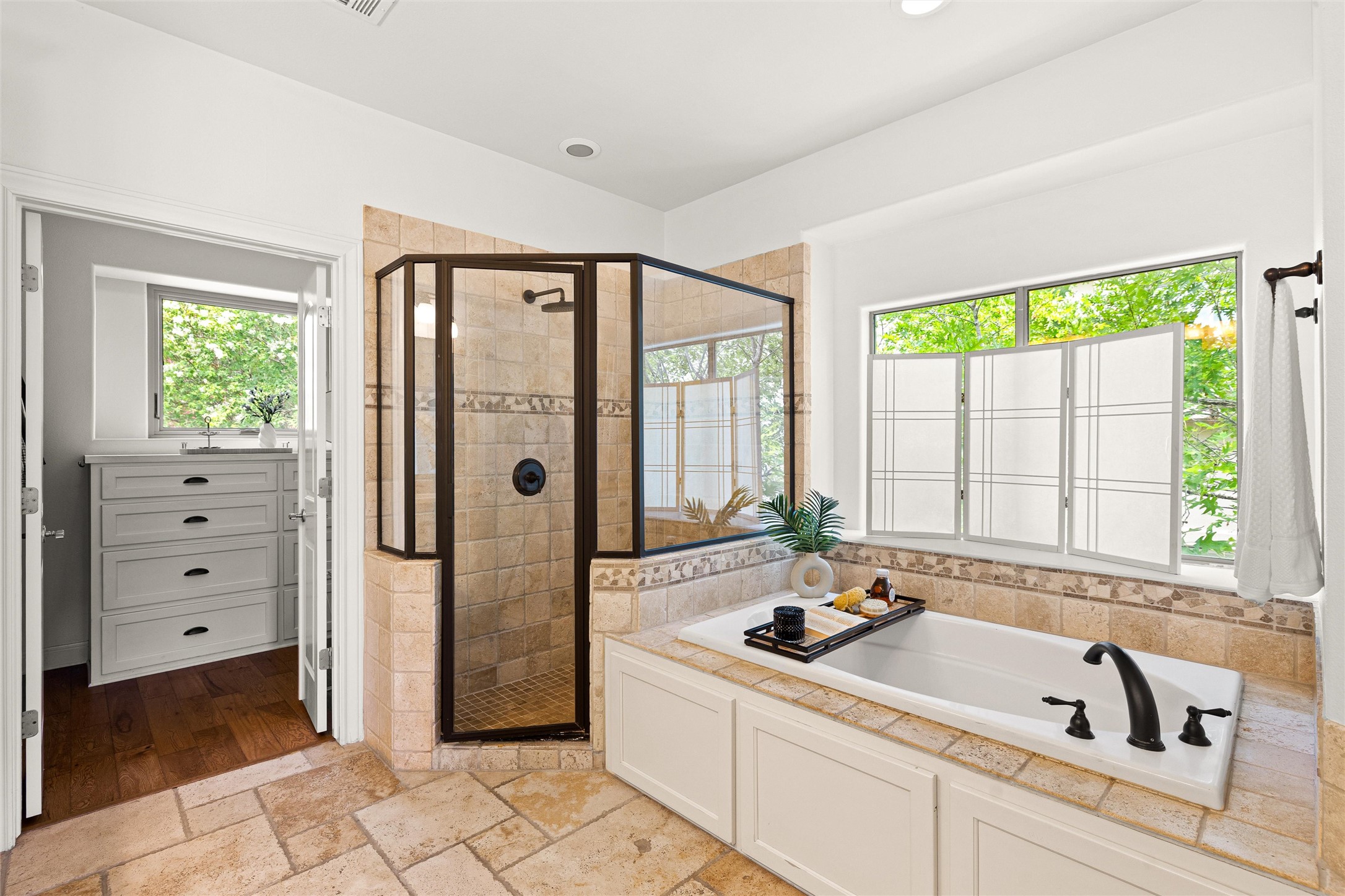 8540 Adirondack Trail, Unit 21 Austin, TX 78759 - Photo 20 of 40 a bathroom with a tub sink and mirror