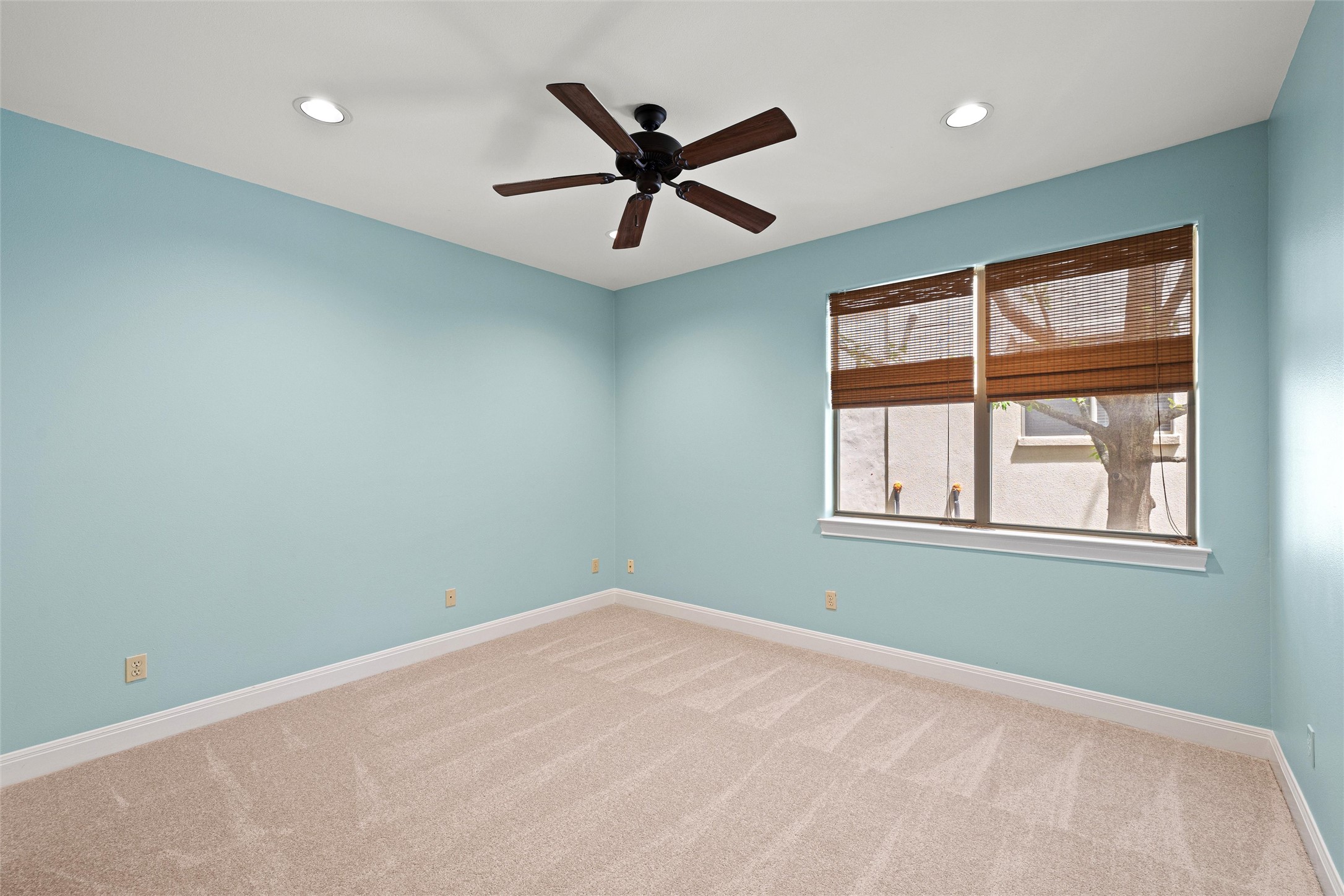 8540 Adirondack Trail, Unit 21 Austin, TX 78759 - Photo 27 of 40 an empty room with ceiling fan and windows