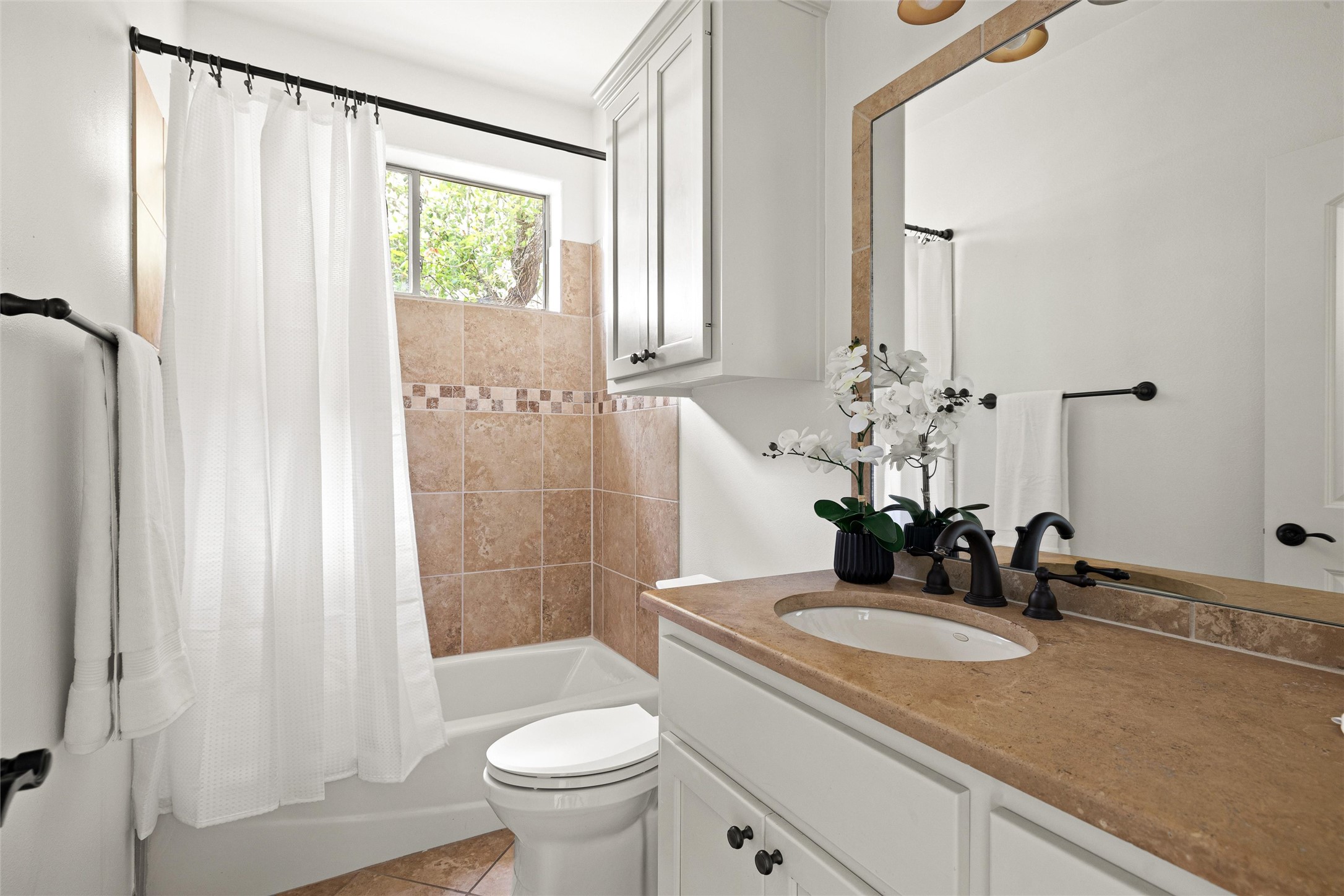 8540 Adirondack Trail, Unit 21 Austin, TX 78759 - Photo 28 of 40 a bathroom with a granite countertop sink toilet and shower