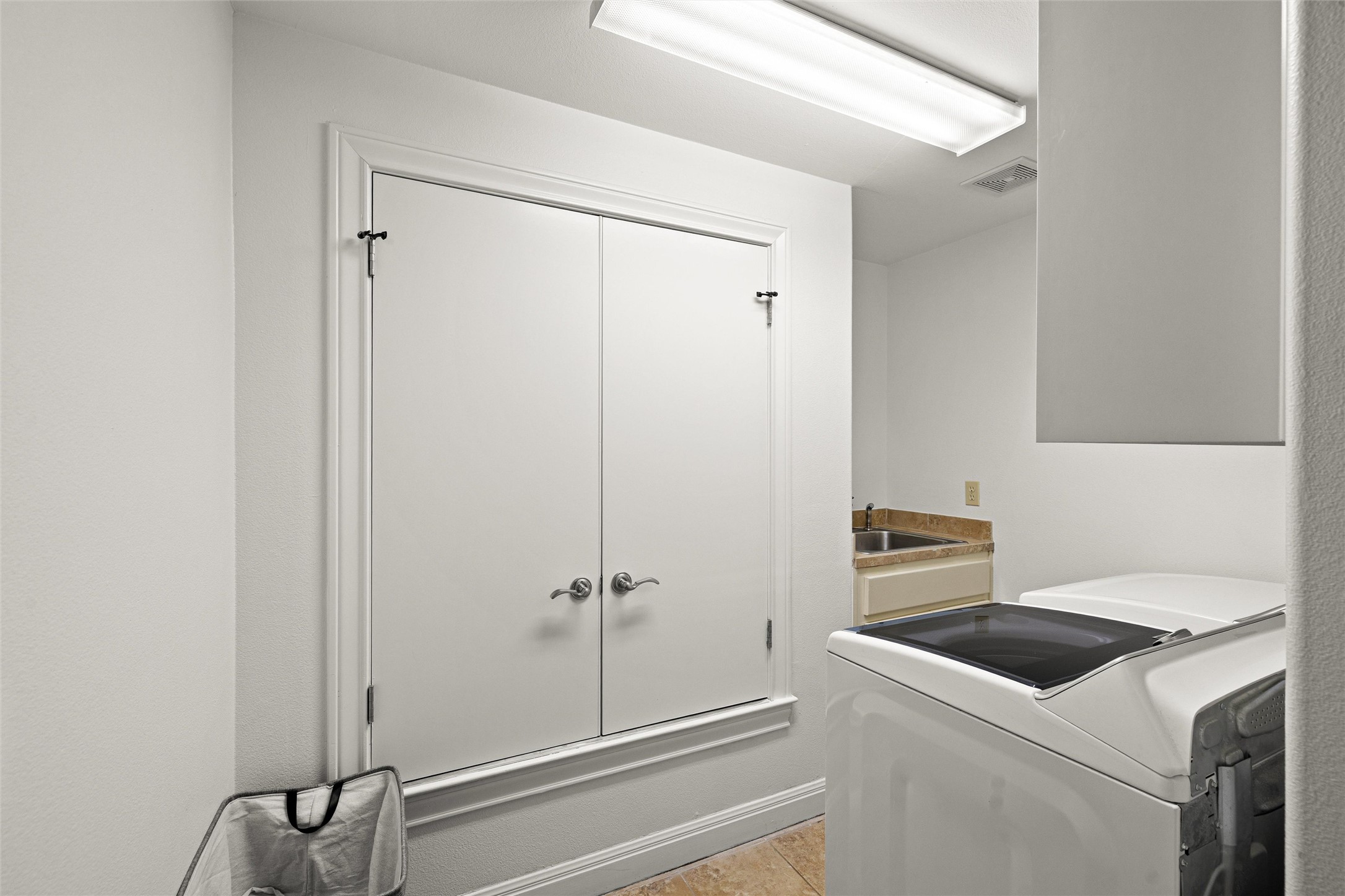 8540 Adirondack Trail, Unit 21 Austin, TX 78759 - Photo 30 of 40 a view of storage and utility room with washer and dryer