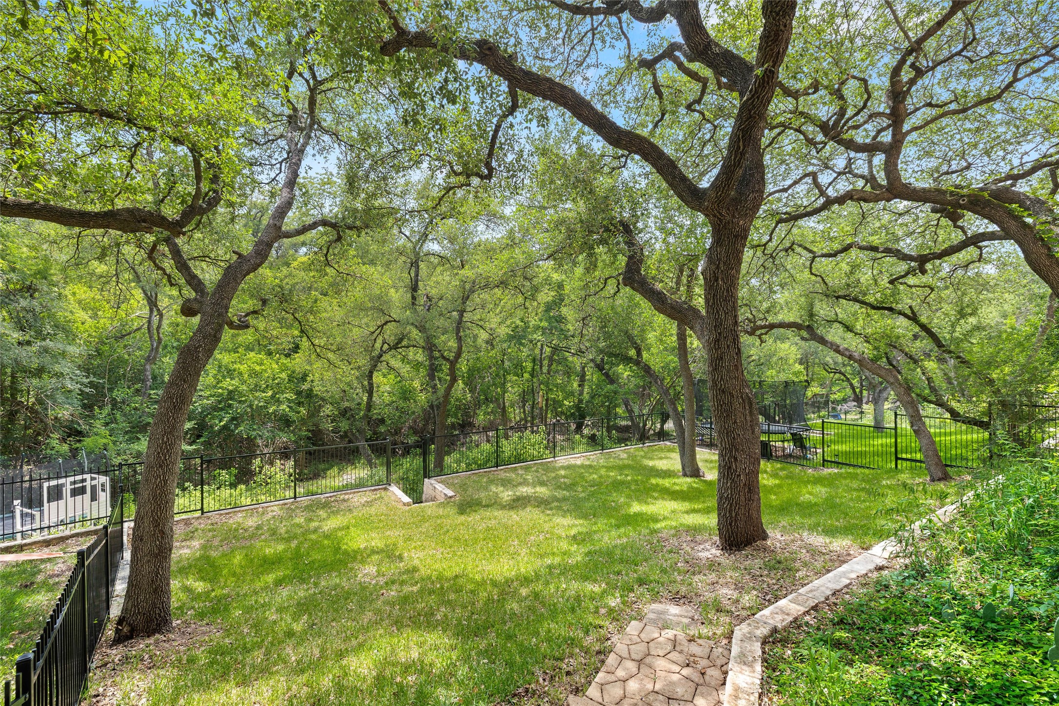 8540 Adirondack Trail, Unit 21 Austin, TX 78759 - Photo 35 of 40 a view of a tree in a yard