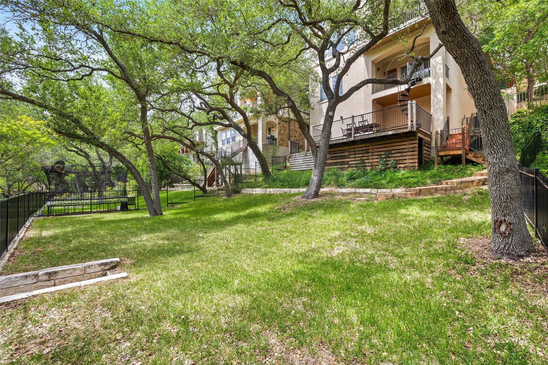 8540 Adirondack Trail, Unit 21 Austin, TX 78759 - Photo 36 of 40 a view of a backyard with large trees