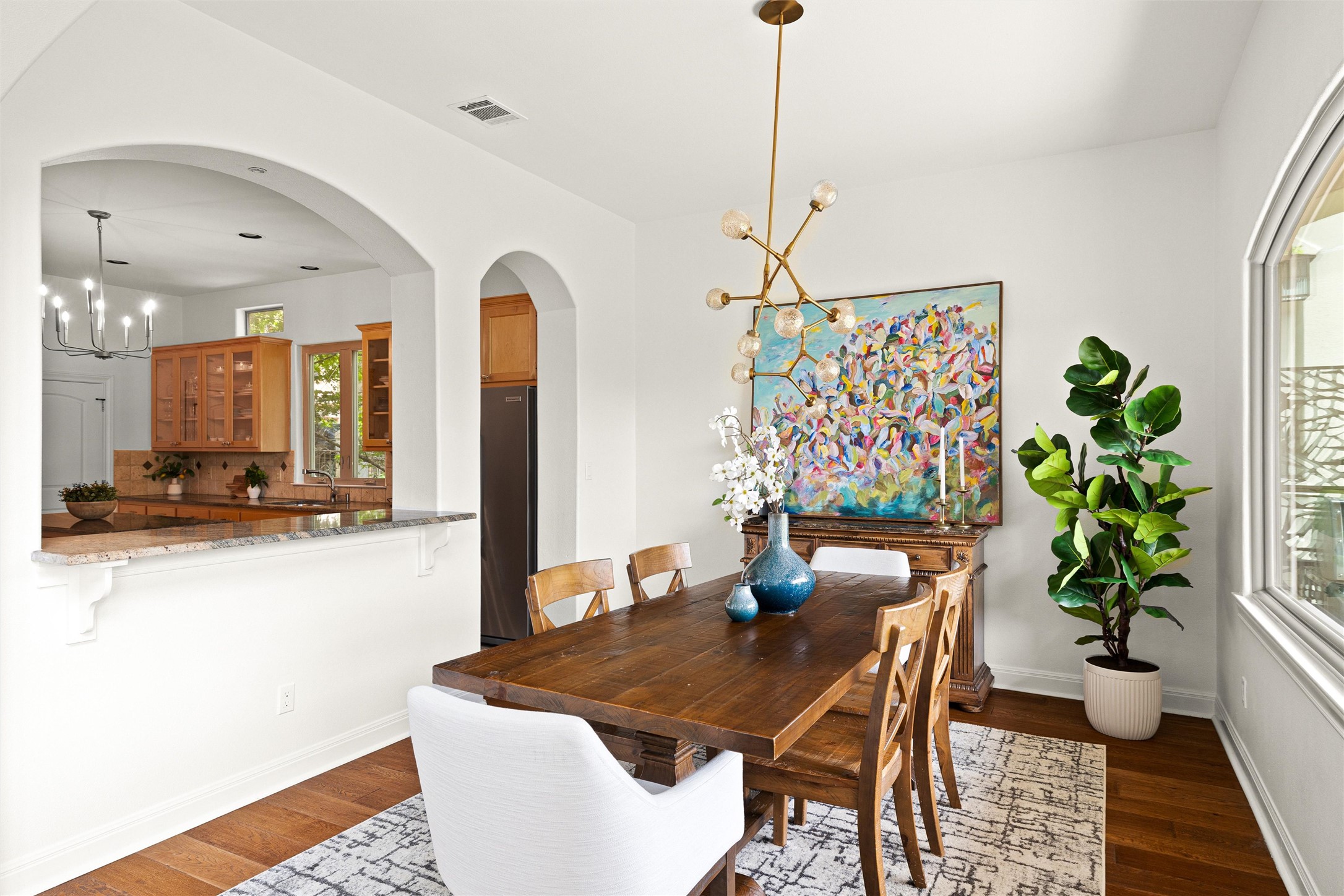 8540 Adirondack Trail, Unit 21 Austin, TX 78759 - Photo 10 of 40 a dining room with furniture and wooden floor