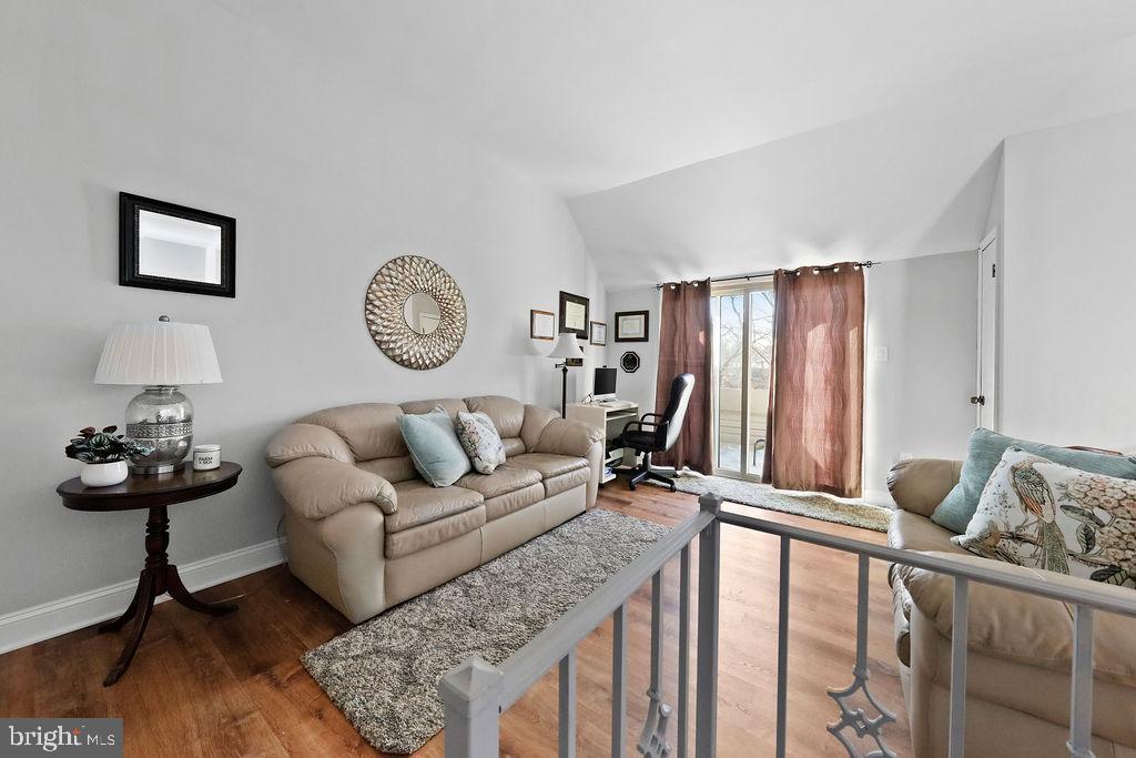 133 Tavistock Cherry Hill, NJ 08034 - Photo 15 of 35 a living room with furniture and a large mirror on the dresser